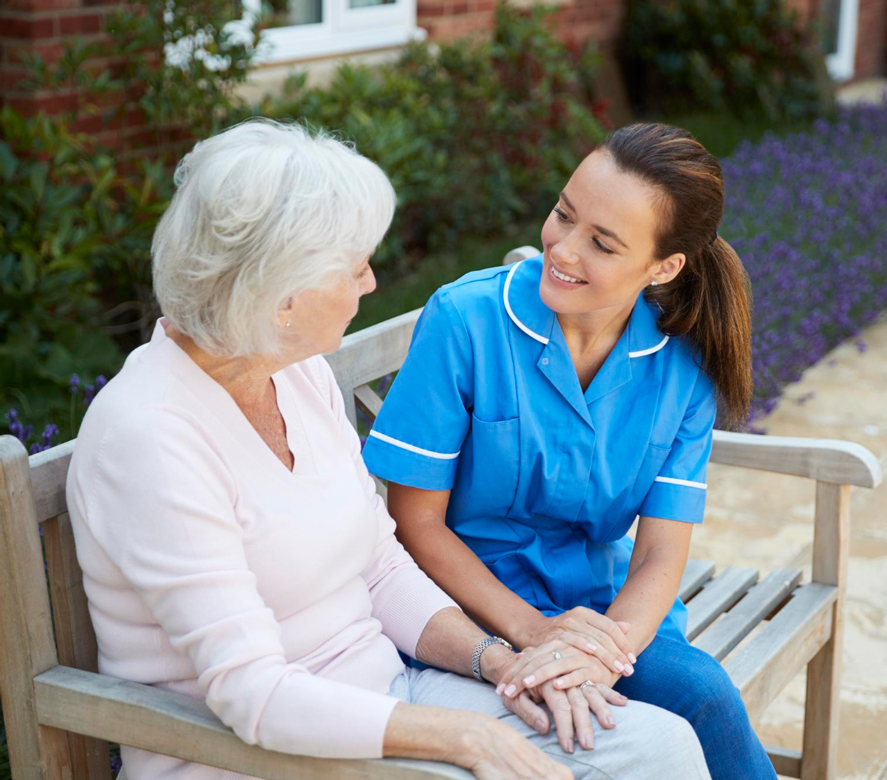 Caregiver with a senior resident outdoors